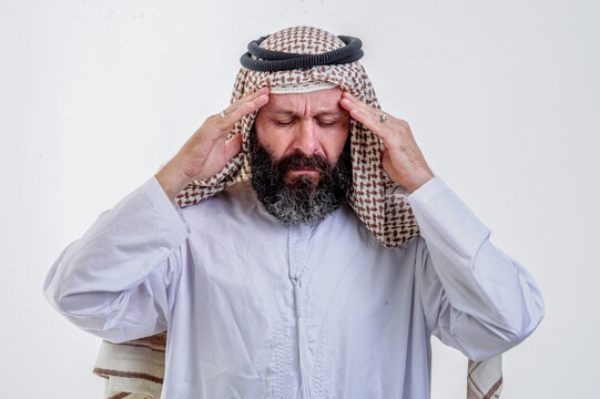 Middle Aged Arab Man having Headache