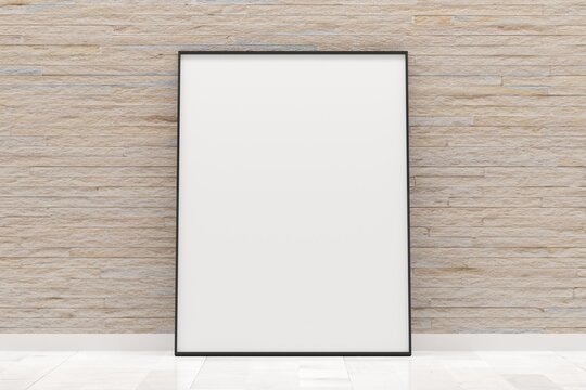 White empty blank picture or poster frame template mock up design standing on wooden floor with brick wall background in room with black frame