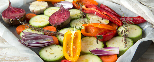 fresh organic cut vegetables on a baking sheet