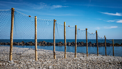 Fototapeta premium Pioppi beach, Cilento, Campania, Italy. Pebbles, blue sea and blue sky