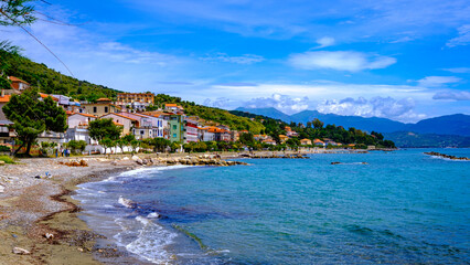 panorama of Pioppi with beach, blue sea and houses. Pioppi, Cilento, Campania, Italy
