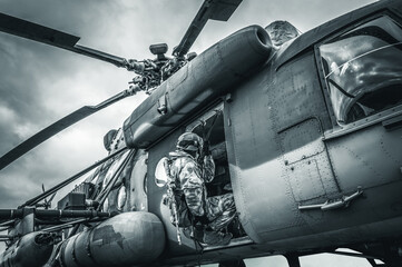Soldier prepares to jump from a helicopter. The concept of computer games.