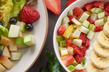 Bowl of healthy fresh fruit salad. fresh fruit and vegetable salad, healthy breakfast. bowl of oat granola with yogurt.