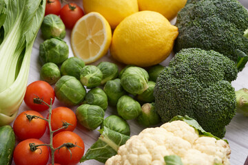 Healthy food background. Food photography different fruits and vegetables on white wooden table background. Copy space. Shopping food in supermarket. studio photo of different fruits and vegetables.