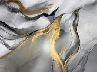 Abstract grey art with gold — black and whited background with beautiful smudges and stains made...