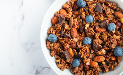 Chocolate granola, muesli with almonds, hazelnuts and blueberries