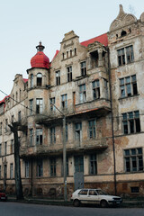 Fototapeta na wymiar An old historic abandoned house with turrets and decorative ornaments on the facade. One of the main attractions of the city of Sovetsk, Kaliningrad Region