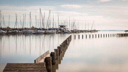 Marina with sailing boats at of City of Rust on lake Neusiedl  in Burgenland on a calm morning