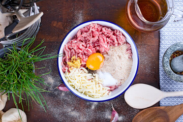 Ingredients for making minced cutlets. Making homemade meatballs in the kitchen