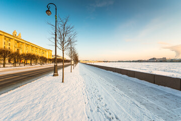 Empty city embankment in winter day. View from the sidewalk
