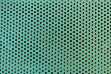 Soft green color perforated grate background