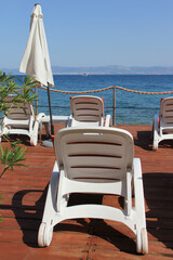 Rows of empty chaise-lounges