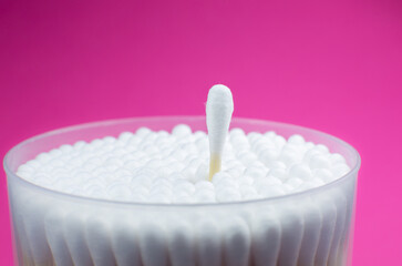 Ear cotton swabs on the pink background. Hygienic ears sticks.