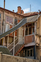 Fototapeta na wymiar Cityscape of the old city of Tbilisi. Balcony of an old building. Soul and atmosphere of Georgia