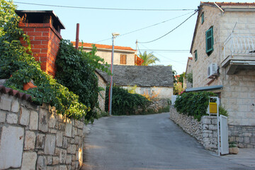 Street in the town Supetar on Brac - obrazy, fototapety, plakaty