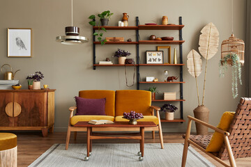 Stylish interior of living room with honey yellow sofa, wooden bookcase, plants, commode, picture frame, carpet, decoration and elegant accessoreis in home decor. Template.