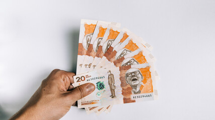 colombian money, twenty thousand pesos on white background