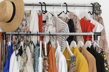 Women's fashion. Different clothes on hangers, close up.	