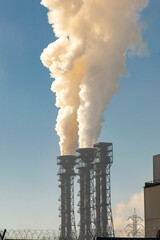 Smoke from chimneys of a metallurgical enterprise. Ecological concept.
