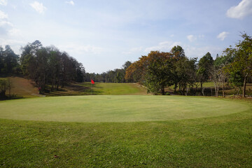 Landscape of a beautiful golf course at the sunset in the countryside.