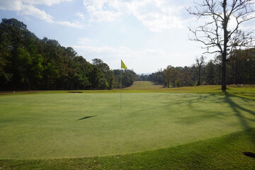 Landscape of a beautiful golf course at the sunset in the countryside.