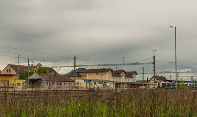 Fototapeta na wymiar Horazdovice station in cloudy rainy spring day