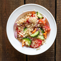 couscous salad tomato, onion, cucumber, spices vegetables appetizer fresh portion organic on the table healthy food meal snack copy space food background rustic. top view keto or paleo diet