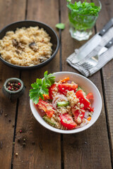 couscous salad tomato, onion, cucumber, spices vegetables appetizer fresh portion organic on the table healthy food meal snack copy space food background rustic. top view keto or paleo diet