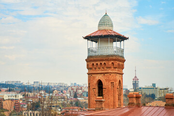 Fototapeta na wymiar Observation tower on the roof of a residential building in Tbilisi. Panorama of the city