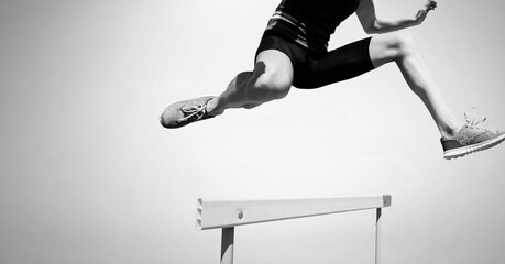 Composition of athletic man jumping on white background
