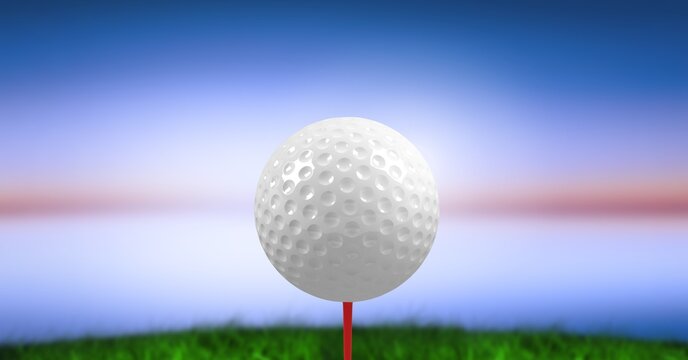 Composition of golf ball on golf course over blue blur