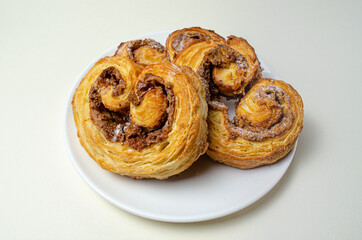French sweet bun. On a white plate High quality photo
