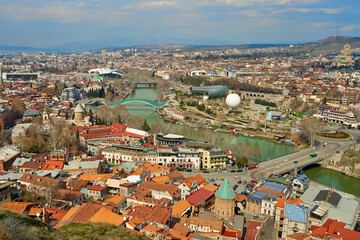 Fototapeta na wymiar Panorama of Tbilisi from above. Old town center. The Kura River