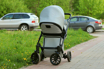 Baby stroller blue color on the street walk