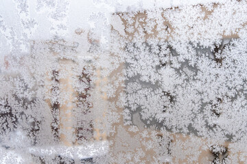 frosted home window and view of apartment houses