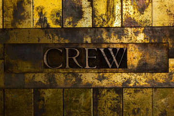 Crew text on textured copper and gold background