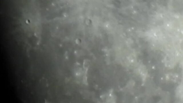 Superzoom Exploring Surface Of Full Moon With Camera Shaky