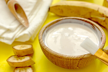 Homemade banana cosmetics. Cosmetic face mask with banana, oatmeal, honey, yolk. Natural skin care, wellness cosmetics,close-up. Diy banana mask,zero waste concept