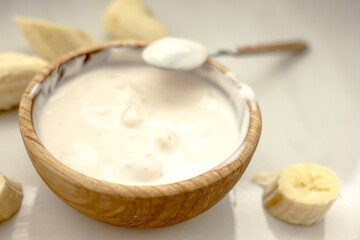 Homemade banana cosmetics. Cosmetic face mask with banana, oatmeal, honey, yolk. Natural skin care, wellness cosmetics,close-up. Diy banana mask,zero waste concept
