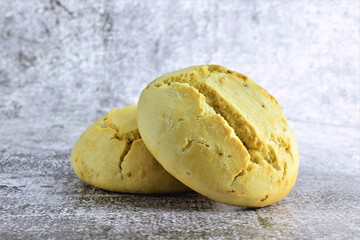 Freshly baked onion breads, on stone background.