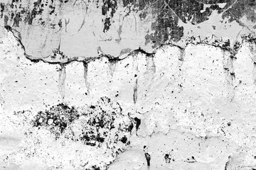 Texture of a concrete wall with cracks and scratches which can be used as a background