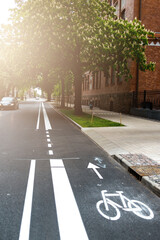 Freshly build bicycle lane in the city,Bike path. Sign white paint on the pavement. Summer. bicycle...