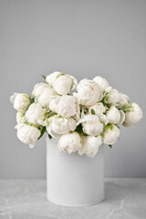 White Odile peonies in a metal vase. Beautiful peony flower for catalog or online store. Floral shop concept . Beautiful fresh cut bouquet. Flowers delivery. Copy space