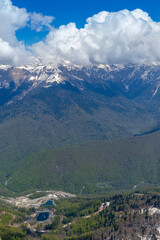 Obraz premium Beautiful snow-capped peaks of the Caucasus Mountains. Rosa Khutor Alpine Resort in Sochi. Krasnodar region. Russia.