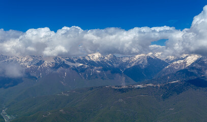 Beautiful snow-capped peaks of the Caucasus Mountains. Rosa Khutor Alpine Resort in Sochi. Krasnodar region. Russia.