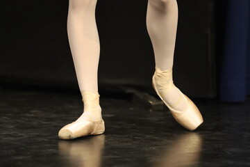dancer legs in ballet shoes