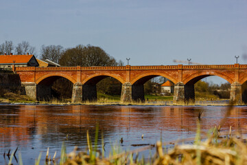 Fototapeta na wymiar looking for postcard image with stunning bridge of Latvia