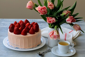 strawberry cake and cup of tea