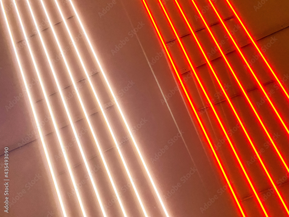 Poster texture of red and white glowing bright neon led multicolored laser abstract stripes and lines from 