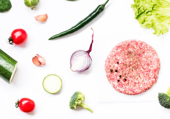 Naklejka premium Top view of Billets for American burgers veal cutlets with vegetables